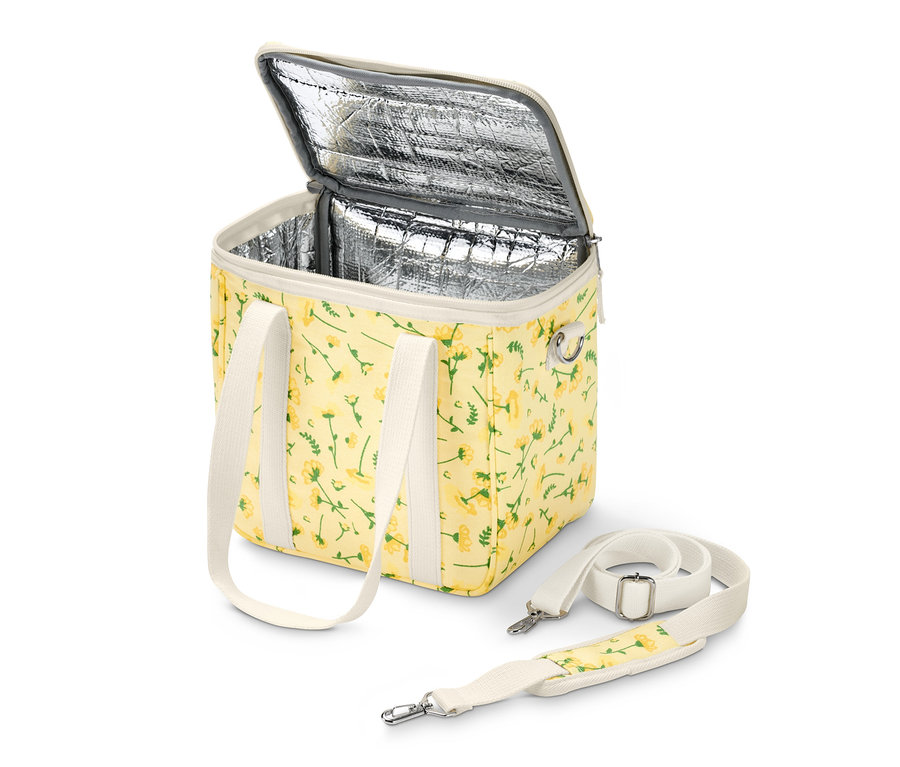 Otvorená chladiaca taška so žltým kvetinovým vzorom a bielymi popruhmi.