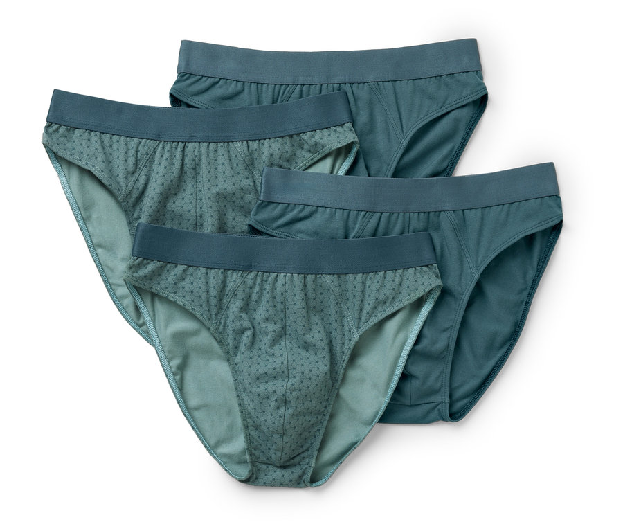 Štyri pánske slipy v odtieňoch modrej na bielom pozadí.