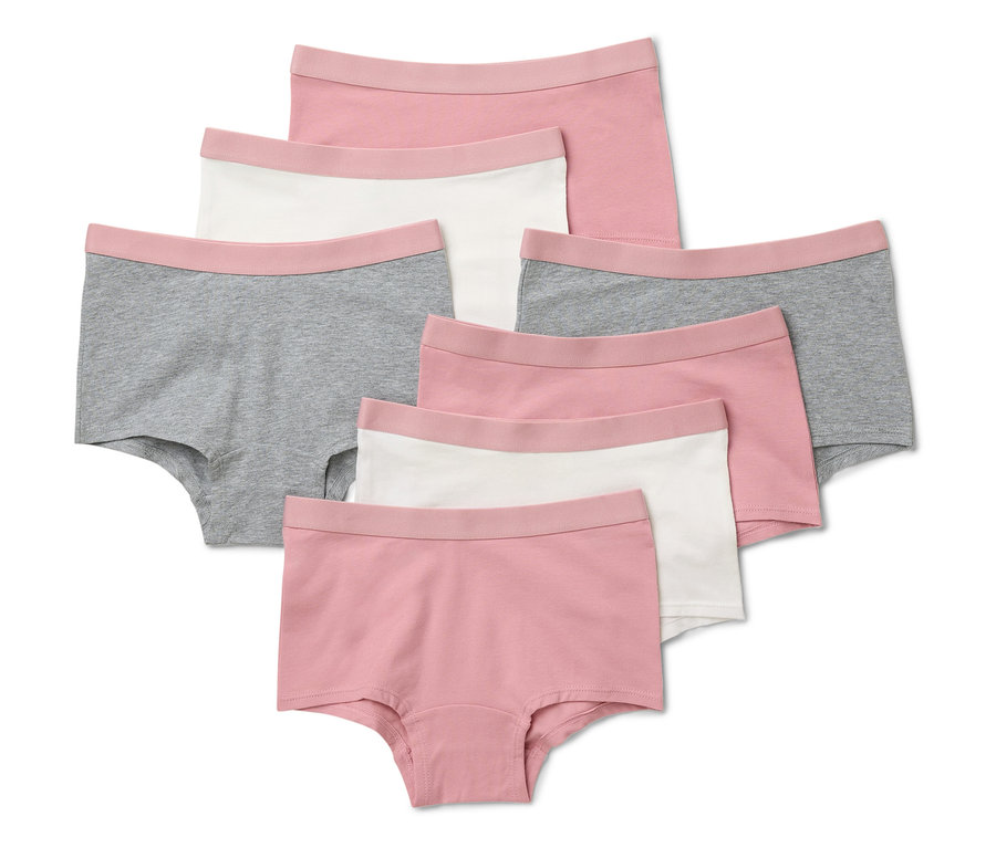 Sedem kusov dievčenských nohavičiek v staroružovej farbe leží na bielom pozadí.