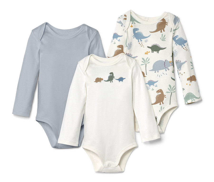 Tri body s dlhým rukávom: sivé, biele s dinosaurami a biele s potlačou dinosaurov.