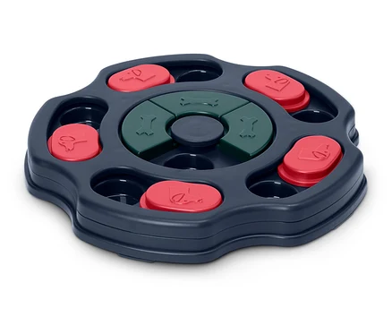 Interaktívna hračka pre psov s otočným mechanizmom, červenými krytkami a zelenými kostičkami.