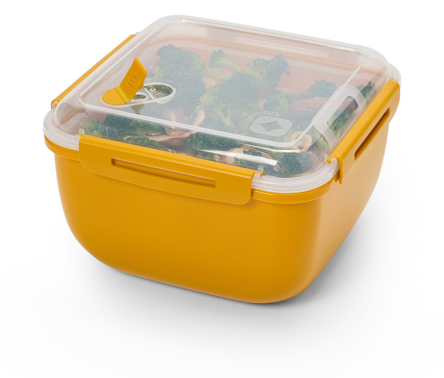 Žltá obedová krabička s brokolicou a hubami.