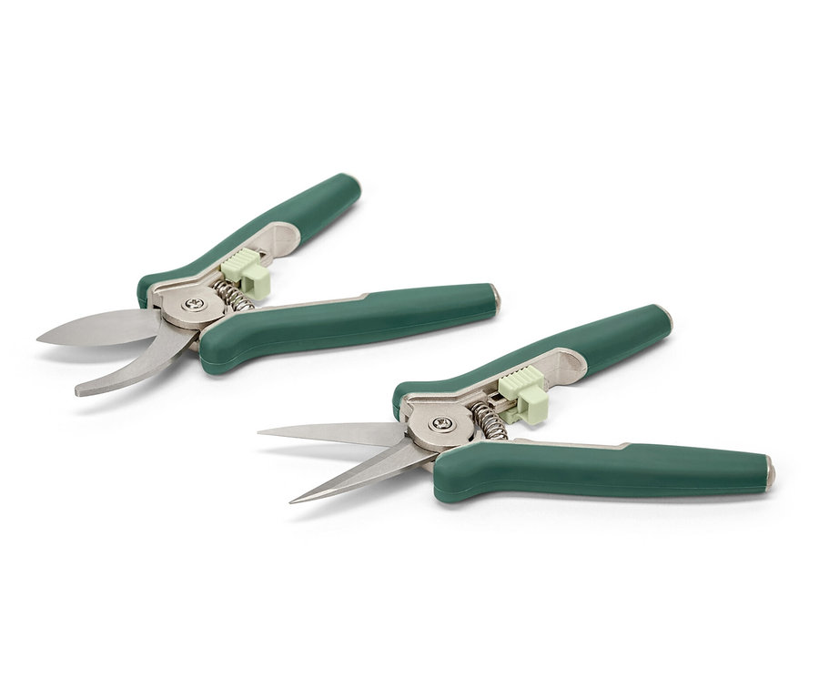 Dvoje záhradnícke mininožnice ležia na bielej ploche.