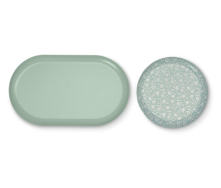 Svetlozelená oválna tácka a okrúhla tácka s kvetinovým vzorom.