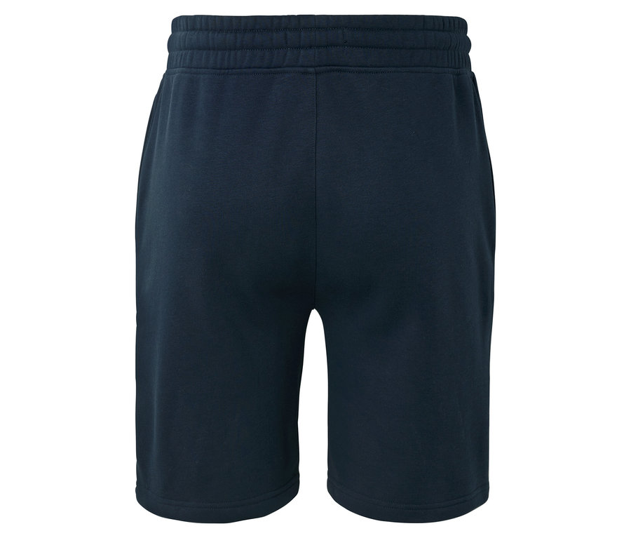 Tmavomodré krátke nohavice, fotené zozadu.