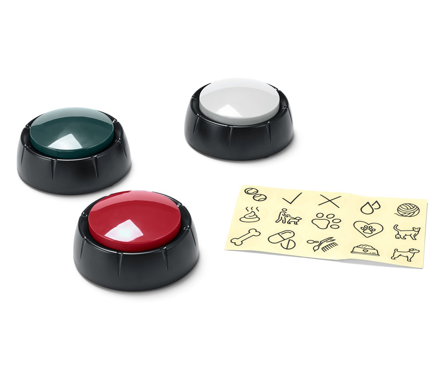 Tri rôznofarebné gombíky (zelený, biely a červený) vedľa žltého papiera s čiernymi kreslenými obrázkami.