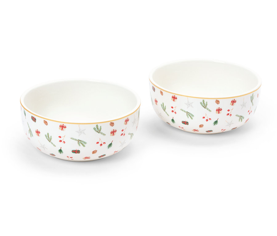 Dve misky s vianočným vzorom stoja na bielom pozadí.