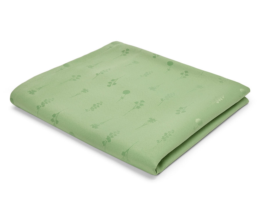 Svetlozelený textilný obrúsok so vzorom stoniek a kvetov.