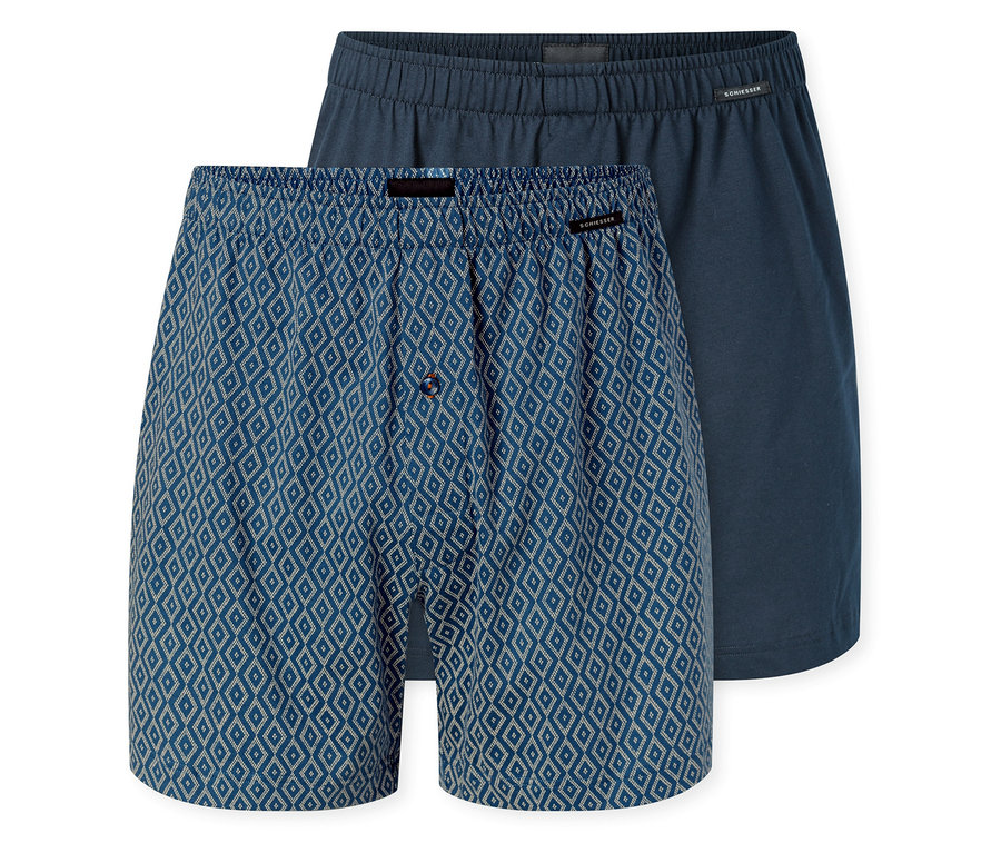 Dvoje džersejové boxerky SCHIESSER; jedny modré s bielym kosoštvorcovým vzorom a gombíkovým rázporkom, druhé jednofarebné tmavomodré.