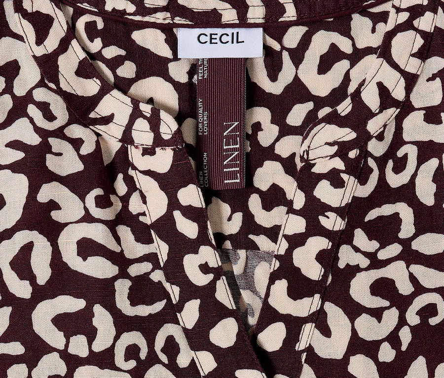 Detailný záber na top CECIL s hnedým a béžovým leopardím vzorom a štítkom LINEN.
