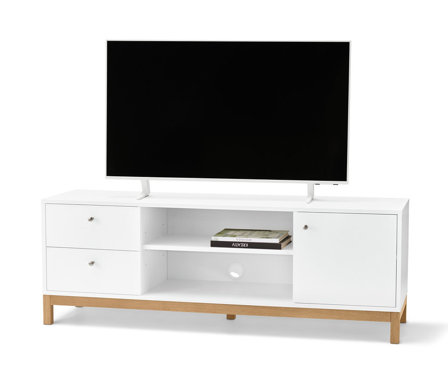 Televízor stojí na bielom televíznom stolíku.