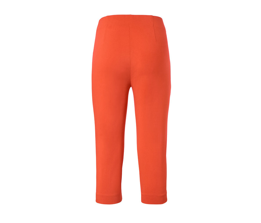 Oranžové 3/4 elastické nohavice.