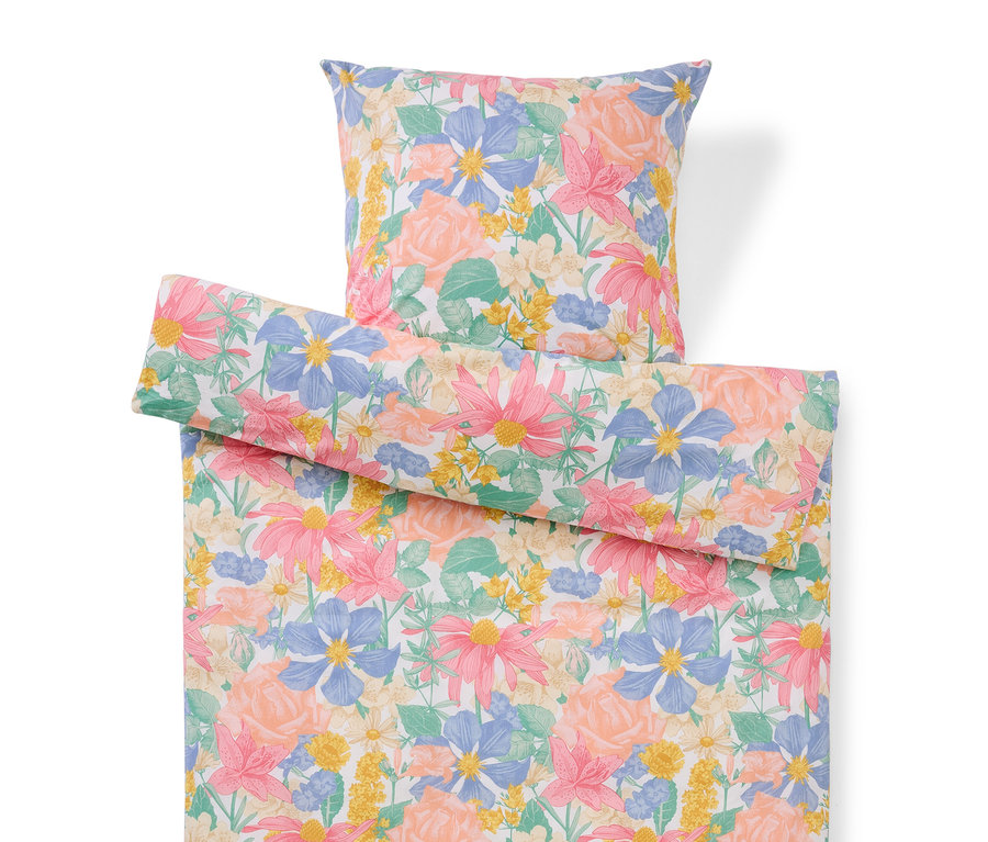 Súprava posteľnej bielizne s kvetinovým vzorom s vankúšom a obliečkou na prikrývku.