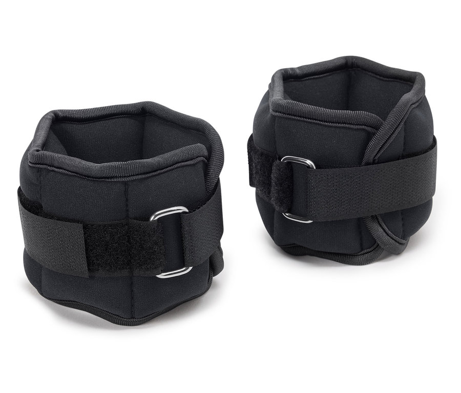 Dve čierne závažia na členky so suchým zipsom.