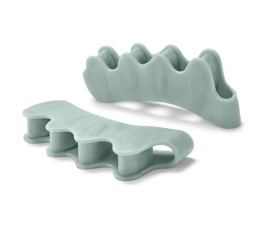 Dva svetlozelené separátory prstov na nohe.