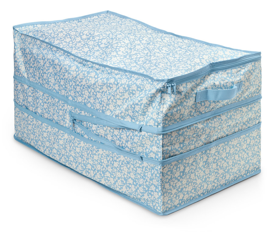 Veľké úložné vrece s modro-bielym kvetinovým vzorom a zipsom.