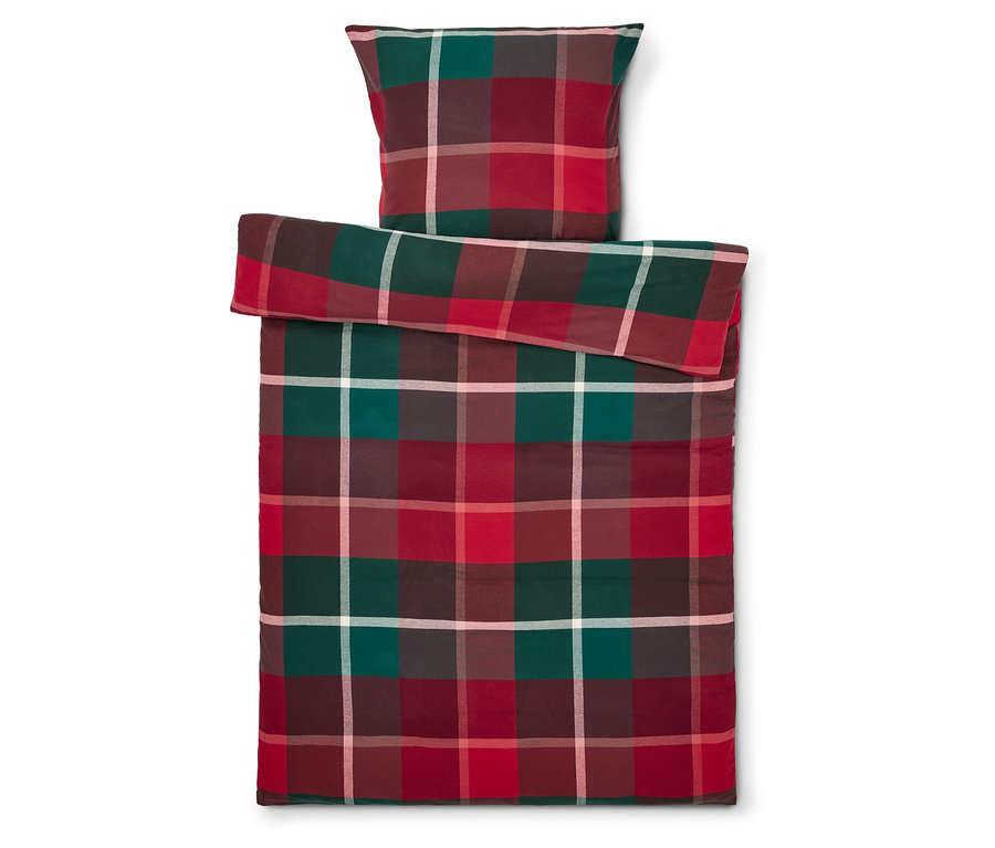 Prikrývka a vankúš so štvorcovým vzorom v červenej, zelenej a bielej farbe.