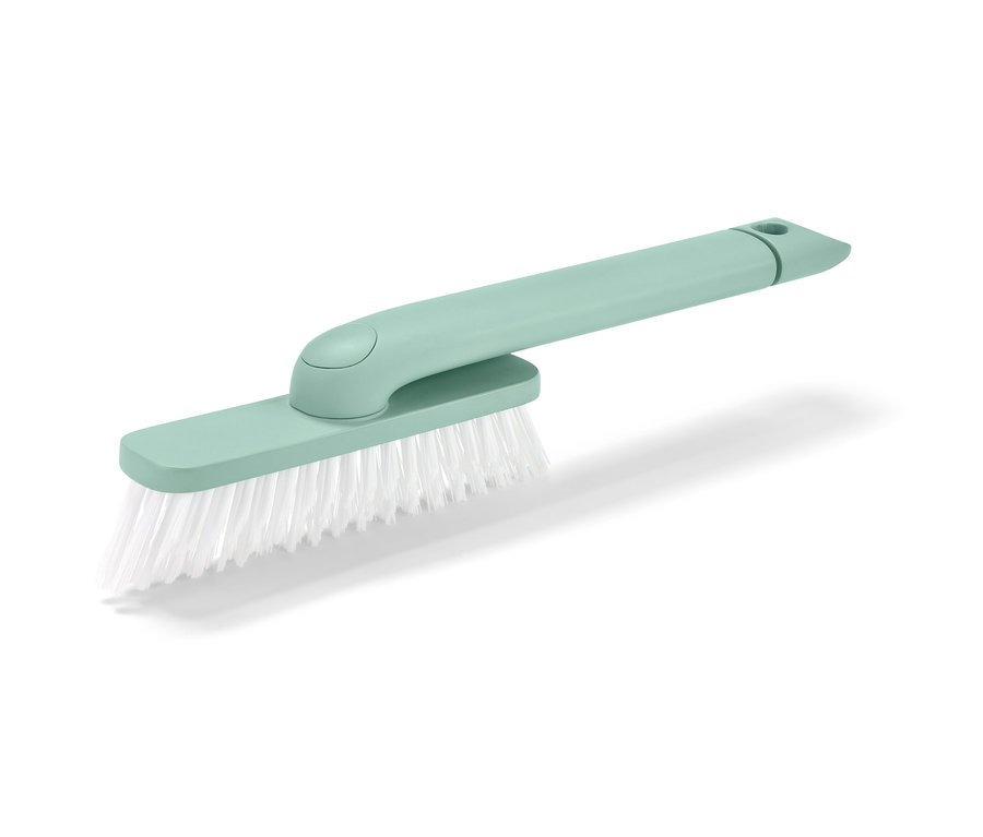 Zelená pomôcka na škárovanie 4 v 1 s bielymi štetinami na bielom pozadí.