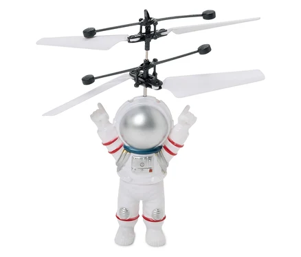 Lietajúca hračka: astronaut s vrtuľami nad hlavou.