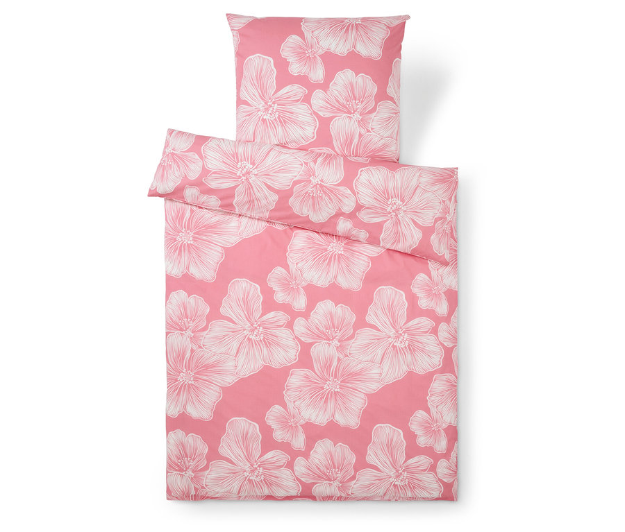 Ružové obliečky s bielymi kvetinovými vzormi, vrátane obliečky na vankúš.