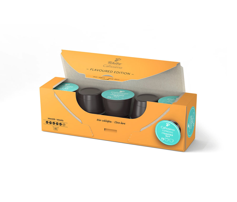 Otvorené, oranžové balenie Cafissimo Flavoured Espresso Toasted Nut s 10 kapsulami, pričom kapsuly sú viditeľné vo vnútri.