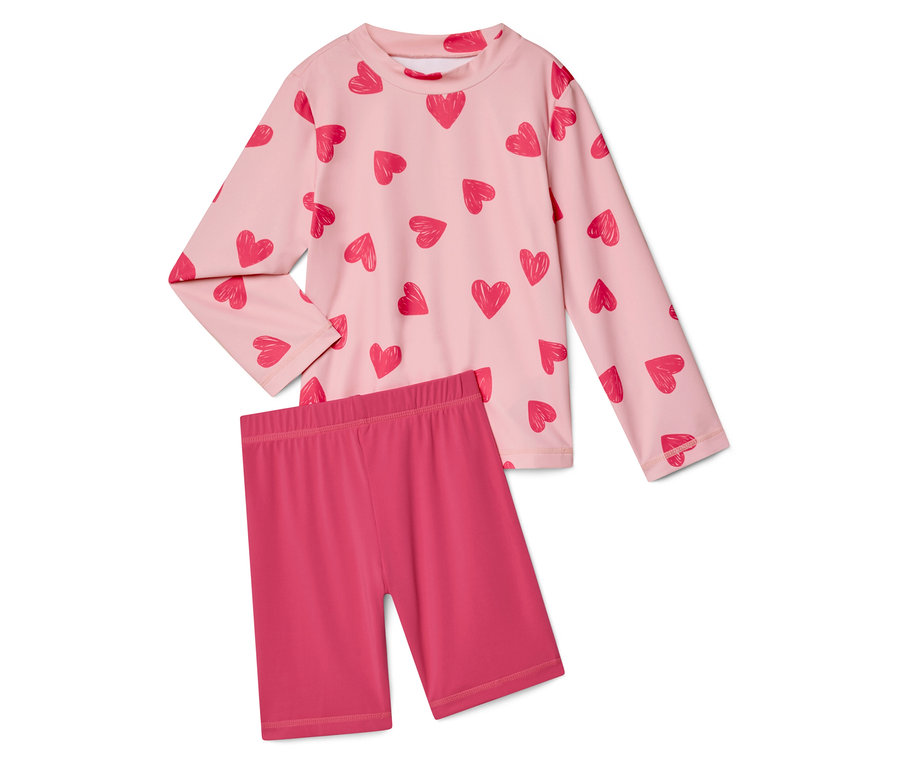 Ružový top s dlhým rukávom so vzorom srdca a ružové krátke legíny.