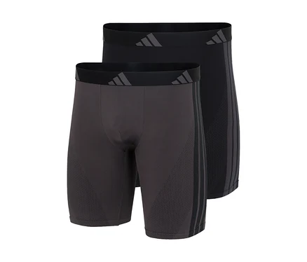 Dvoje boxerky adidas Active Seamless Long v tmavosivej a čiernej farbe, s logom adidas na páse a tromi pruhmi na boku.