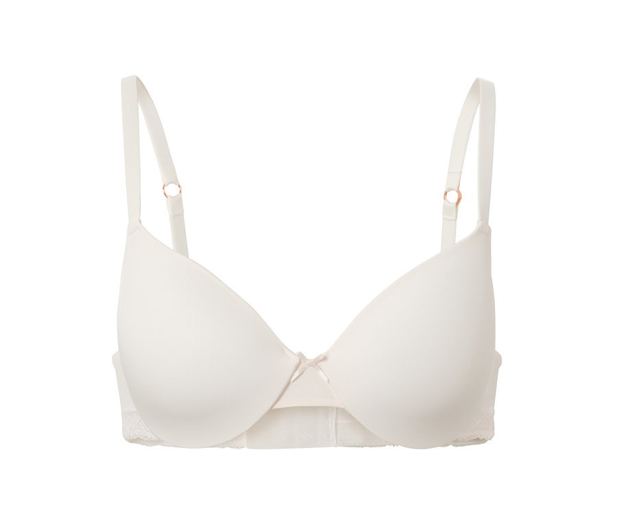 Krémová podprsenka pod tričko s mašličkou uprostred.