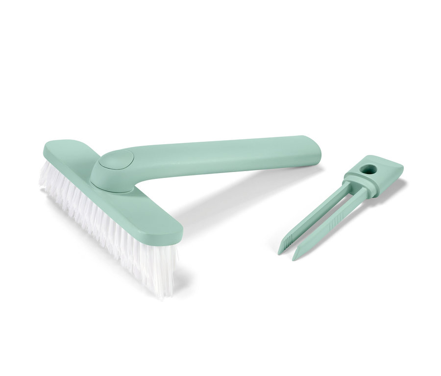 Zelená pomôcka na škárovanie 4 v 1 so štetcom a nástrojom na odstraňovanie nečistôt.