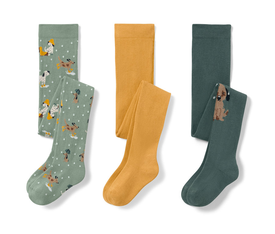 Troje detské pančuchy: svetlozelené s potlačou psov, žlté a tmavozelené s obrázkom psa.