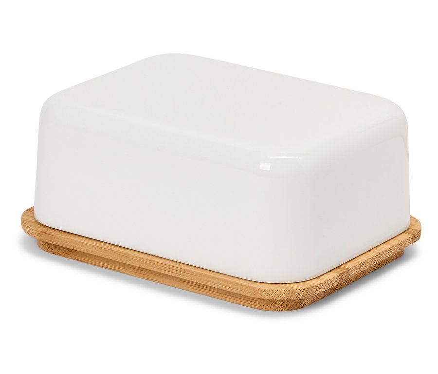 Biela maselnička s bambusovým vekom na bielom povrchu.