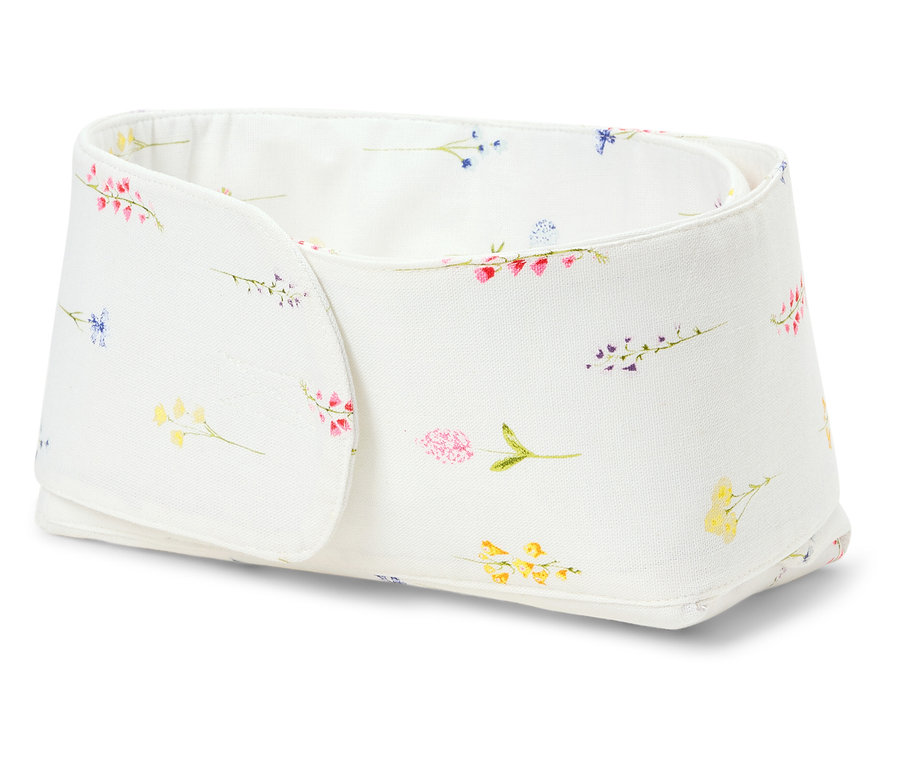 Biely úložný box s kvetinovým vzorom.