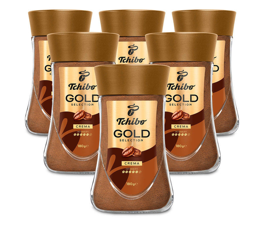 Šesť pohárov instantnej kávy Tchibo Gold Selection Crema je usporiadaných v dvoch radoch.