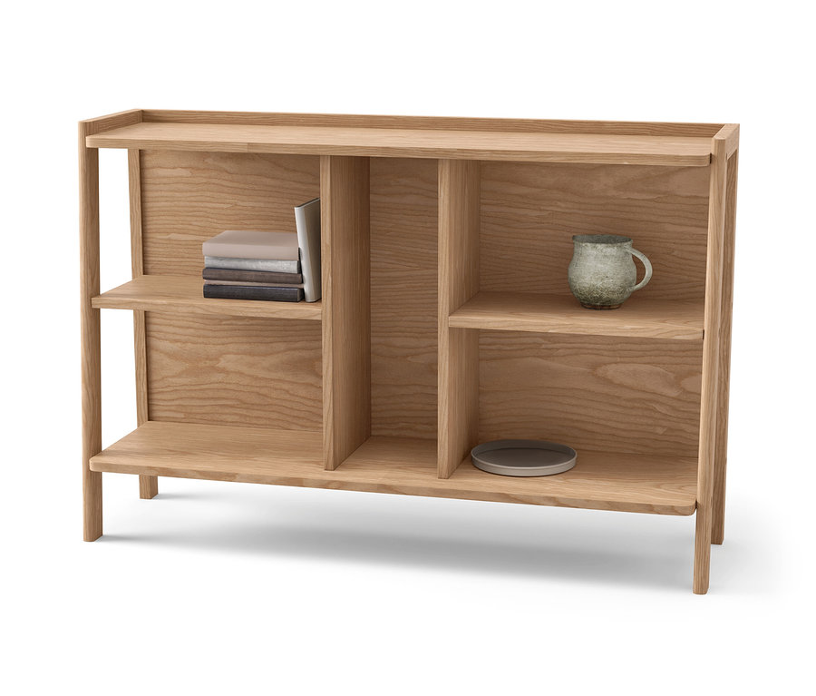 Komoda z hnedého dreva s knihami, hrnčekom a tanierom.