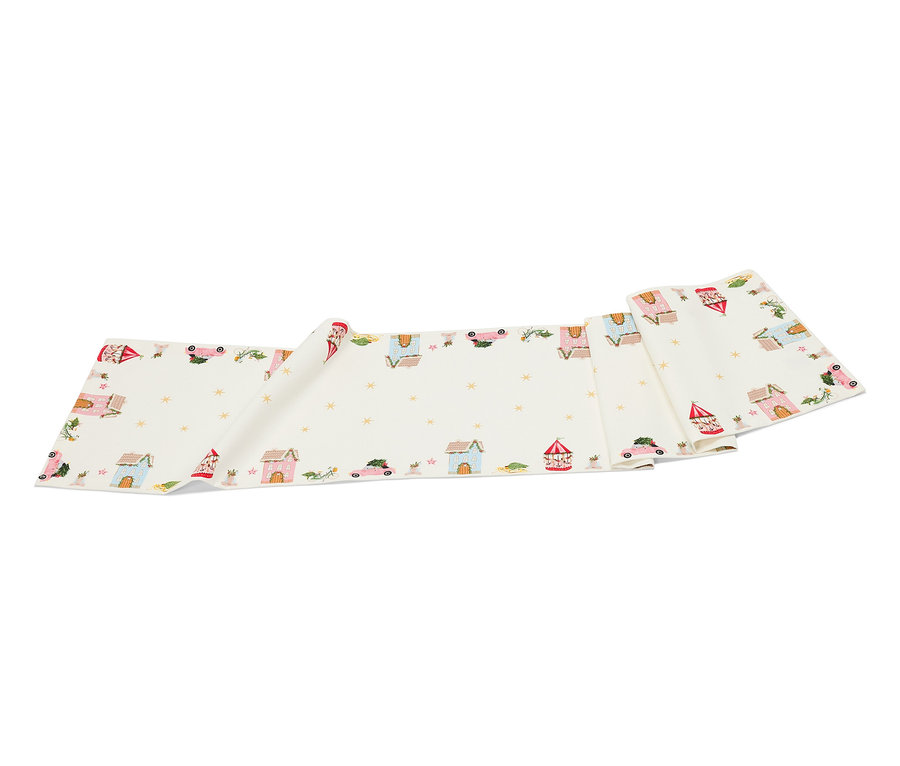 Biely látkový pás s kreslenými domami, autami a hviezdami.