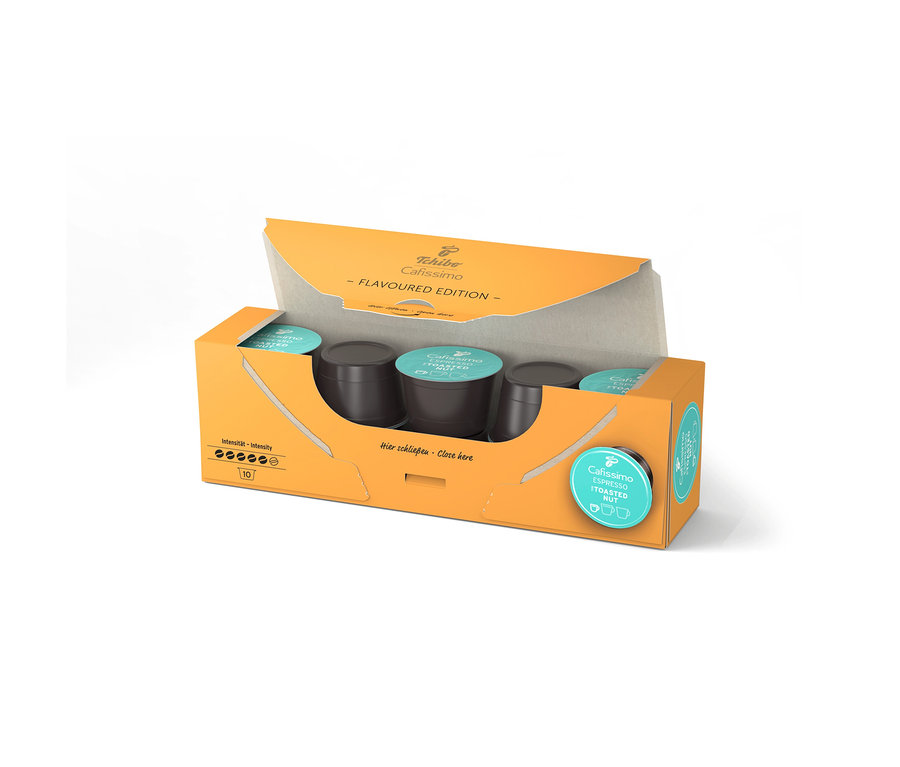 Otvorené, oranžové balenie Cafissimo Flavoured Espresso Toasted Nut s 10 kapsulami, pričom kapsuly sú viditeľné vo vnútri.