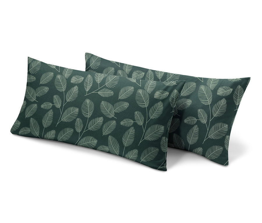 Dve zelené flanelové obliečky na vankúše s potlačou listov.