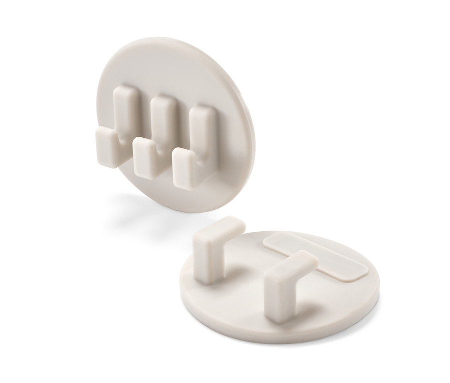 Dve samolepiace súpravy držiakov.