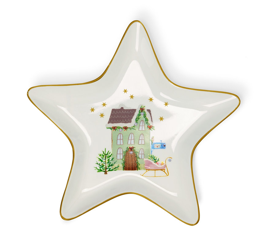 Biely tanier v tvare hviezdy s vianočnou ilustráciou domu, stromu a saní.