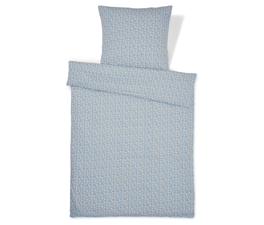 Modrá džersejová posteľná bielizeň so vzorom, štandardná a nadmerná veľkosť, rozložená.