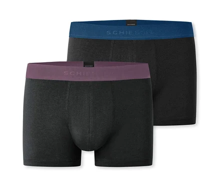 Dvoje čierne, dlhé boxerky SCHIESSER ležia na sebe.