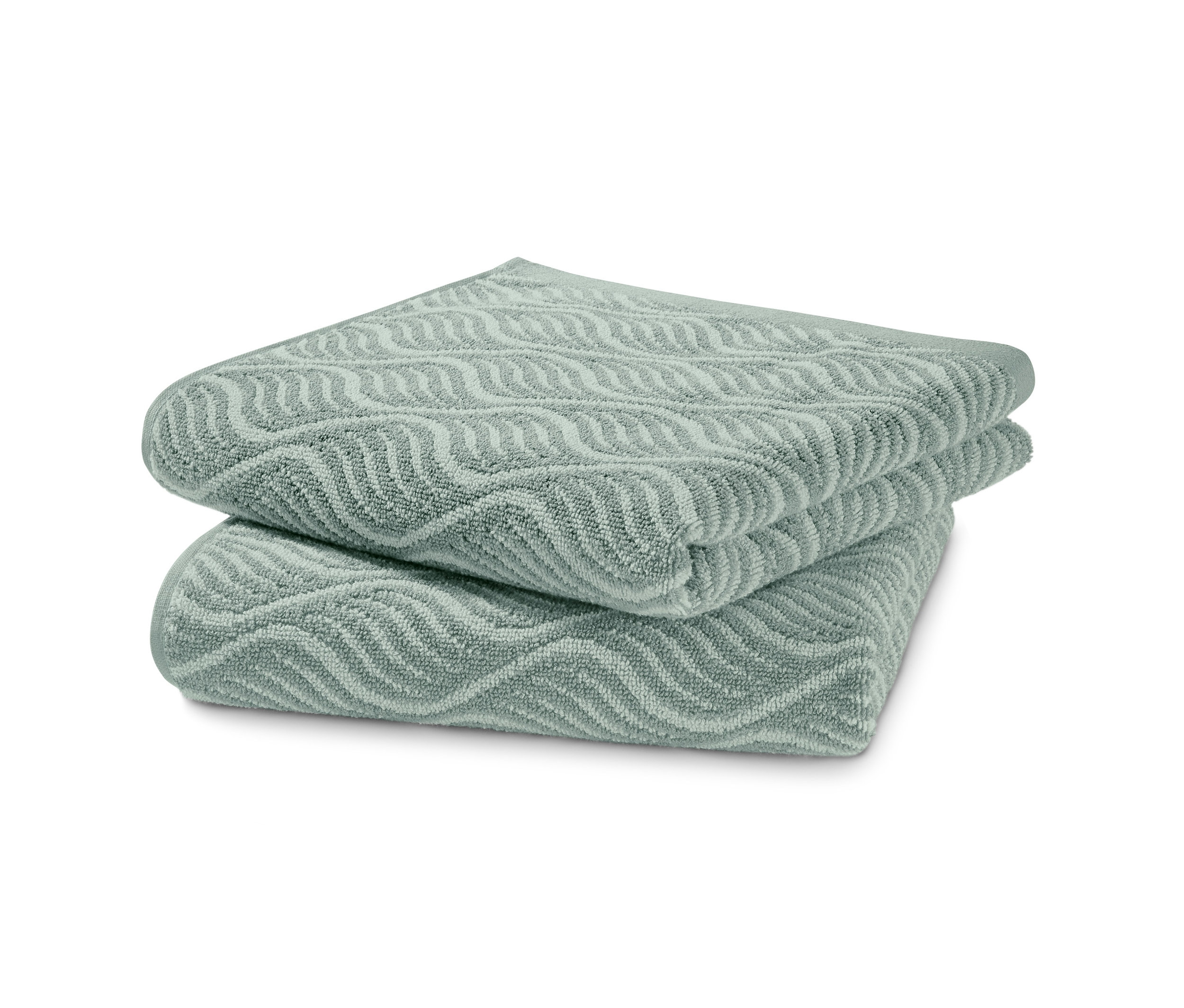 Dva žakárové uteráky naskladané na sebe.