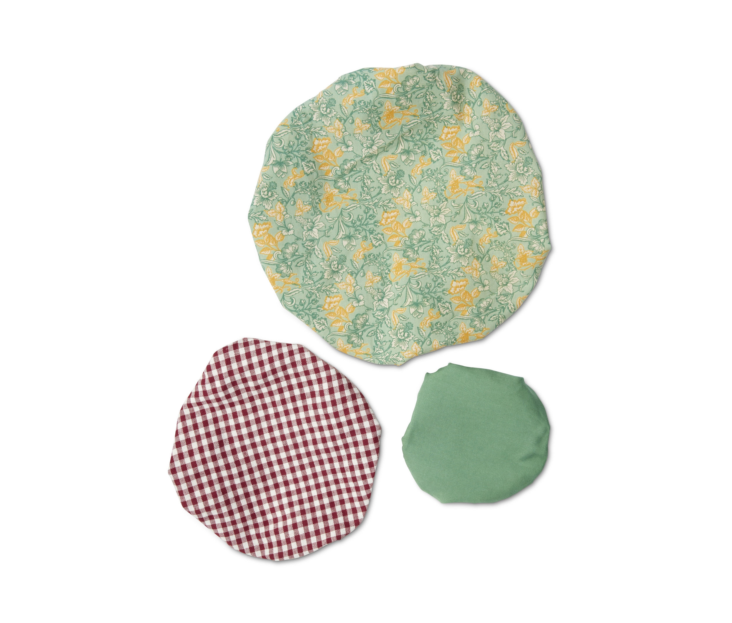 Sada troch textilných krytov s rôznymi vzormi.