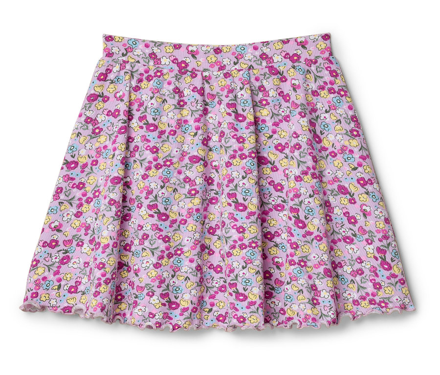Ružová sukňa s kvetinovou potlačou leží na bielom pozadí.