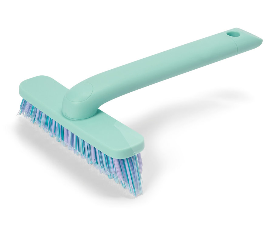 Tyrkysová drhnúca kefa s modrými a fialovými štetinami.