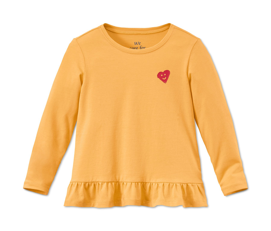 Žlté tričko z biobavlny s dlhým rukávom, s červeným srdiečkom a volánikmi.