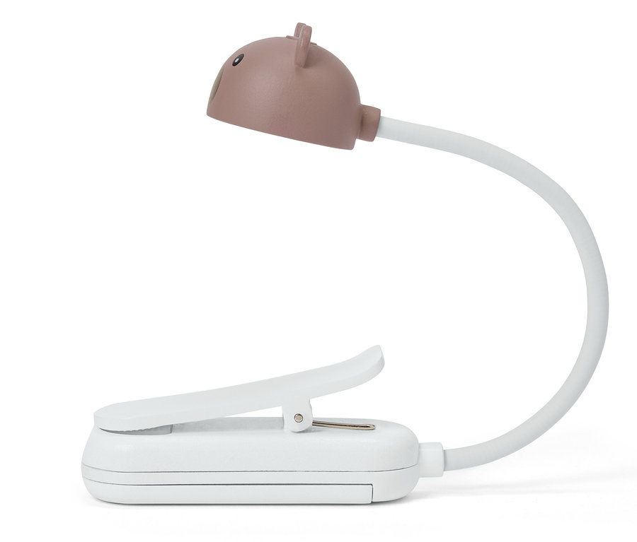Detailný záber na bielu lampu na čítanie s klipom a hnedou hlavou v tvare medveďa.