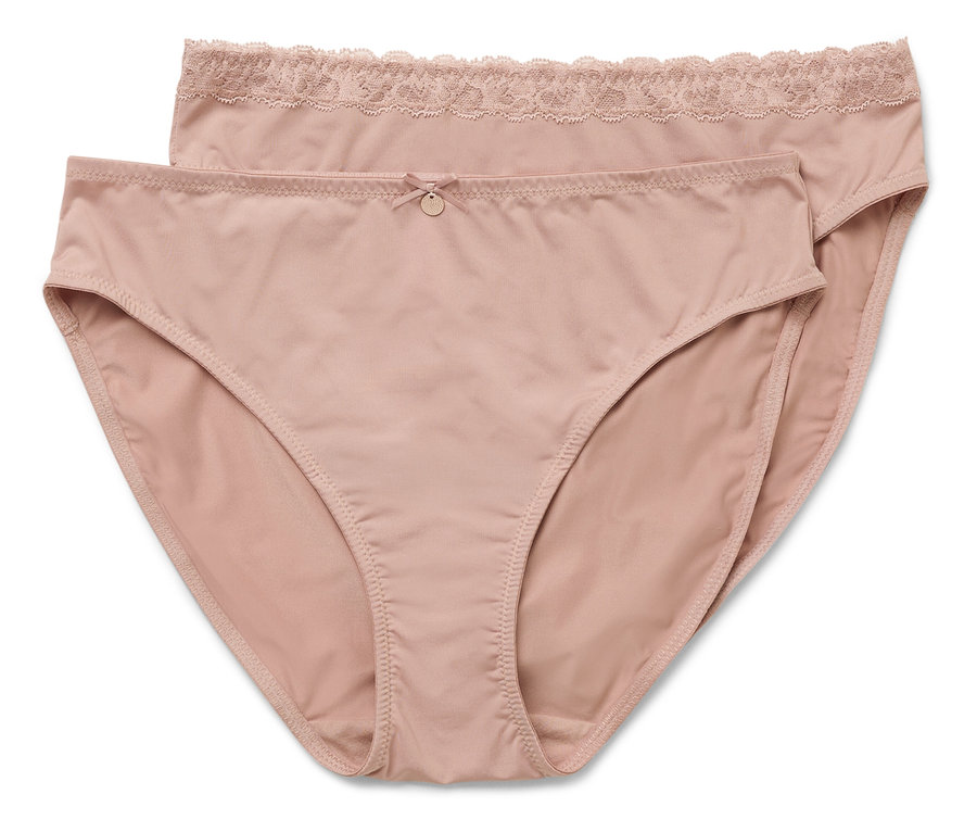 Dvoje ružových nohavičiek leží na sebe.