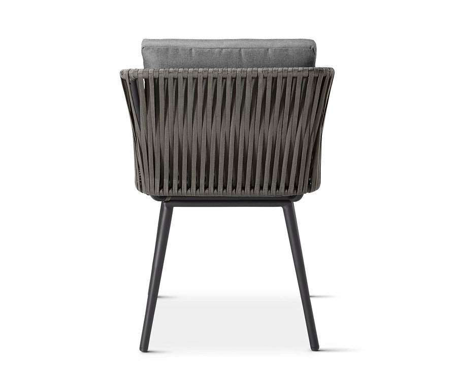 Pohľad zozadu na jedálenské kreslo »Jara« s textilným pletivom a sivým vankúšom.