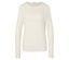 Krémovo biely sveter s dlhým rukávom.